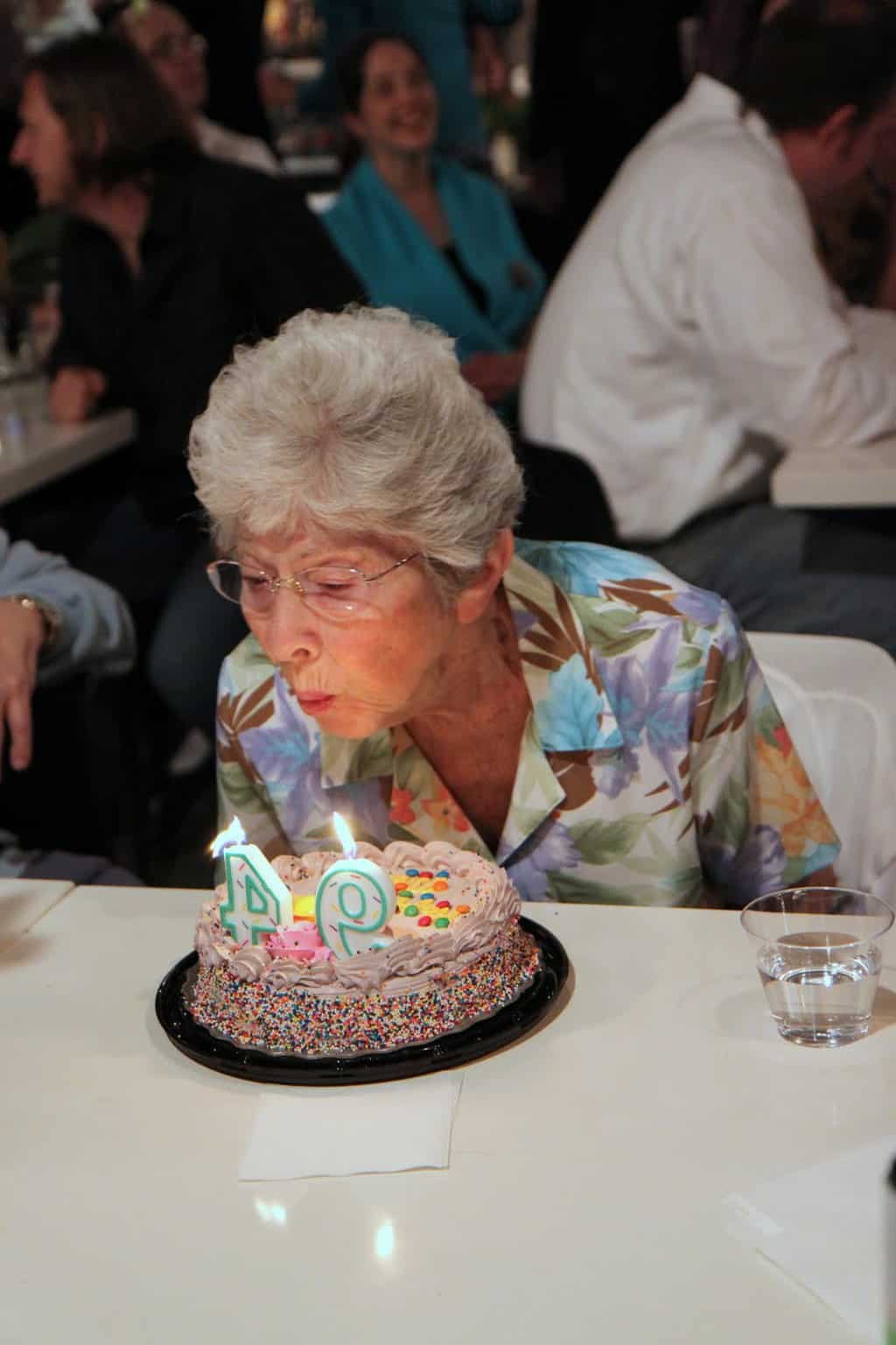 Martha Sigall blows out birthday candles at Artworks- Happy 94th Martha!